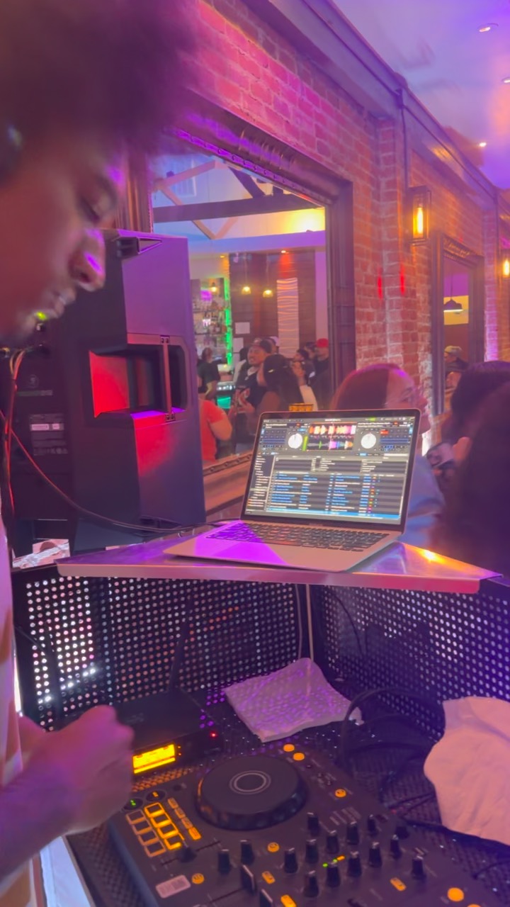 DJ controller and laptop set up at an event